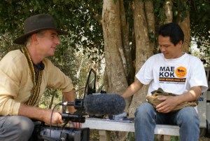 Gavin preparing to film an informal interview with Mr Somkiat Khuenchiangsa, coordinator of the Mekong-Lanna Natural Resource and Culture Conservation network